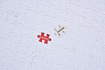 'Question and answer' word on white puzzles with red background flat lay concept. 