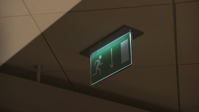 Flashing green emergency exit sign. 