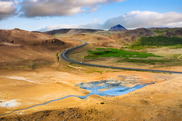 Aerial view on road in Iceland. Aerial landscape above highway in the geysers valley. Icelandic landscape from air. Famous place. Travel and vacation image