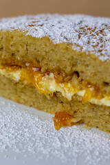 slice of apple cake with apricot jam and buttercream filling 