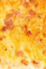 Savoury white bread roll with melted cheese and bacon