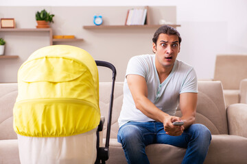 Young male contractor looking after new born at home