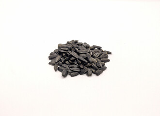 fried seeds. fried sunflower seeds on a white background side view