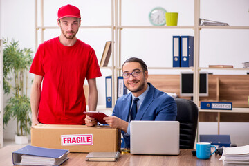 Young man delivering parcel to the office