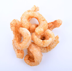 Pork snack or Pork rind leather lean pork fried crispy and blistered isoloated on white background. Thai food, Close-up