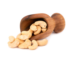 Cashew nuts in wooden scoop, isolated on white background. Roasted cashew nuts.