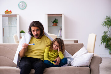 Small girl looking after her sick father