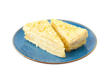 Plate with slice of homemade puff pastry with cream. Studio Photo