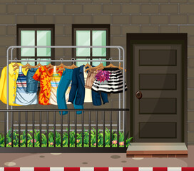 Many clothes hanging on a clothes rack in front of the house scene