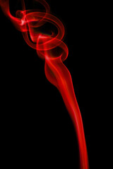 Obraz premium swirling movement of red smoke group, abstract line Isolated on black background