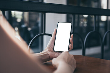 cell phone blank white screen mockup.woman hand holding texting using mobile on desk at office.background empty space for advertise.work people contact marketing business,technology