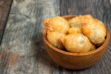 Molen in a bowl on a wooden table.
traditional food snack of indonesia