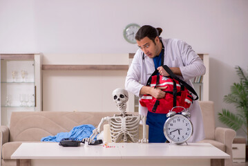 Young male paramedic visiting skeleton patient