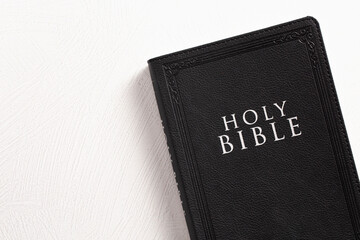 Holy Bible on a Textured White Surface