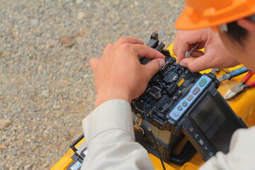 Engineer is connecting Fiber Optic cable.
