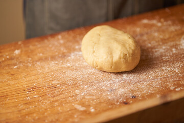 cook kneads his preparation before baking