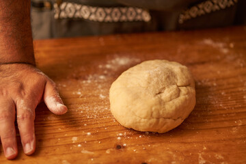 cook kneads his preparation before baking