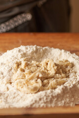 cook kneads his preparation before baking