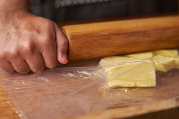 Chef at home cooking whit butter