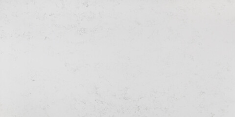 A simple white quartz slab with grey and sage green speckles