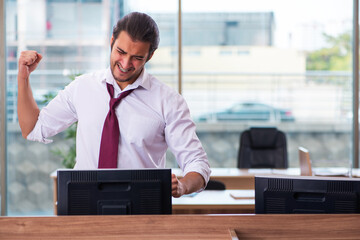 Young male employee and too many work in the office