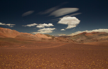 Arid desert landscape high in the Andes mountain range. View of the dunes, brown land and colorful mountains in Laguna Brava, La Rioja, Argentina.