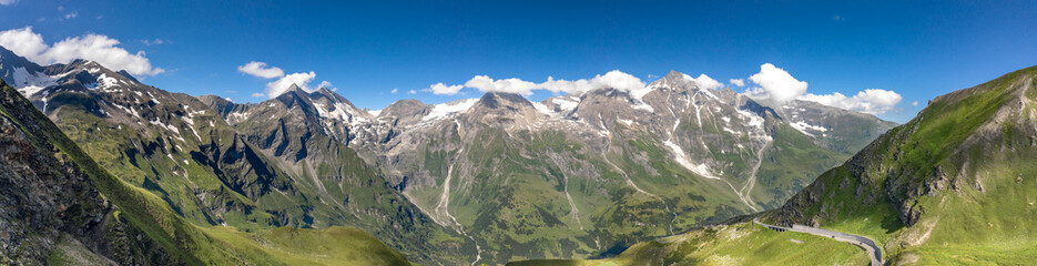 Fototapeta na wymiar Panoramic aerial view of Grossglockner mountain range covered in snow in summer Austria
