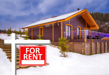 Rental house. House for rent with a red sign. Inscription that the house is for rent. Concept - investment in construction for rent. Investment in rental property. Private cottatge rental business