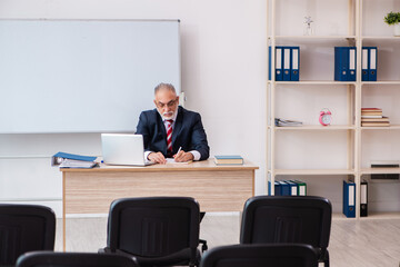 Old male business couch in the classroom during pandemic