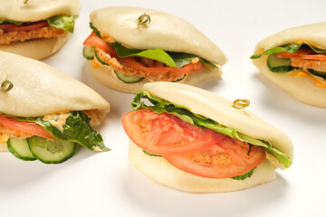 Bao buns. Hawaiian dish on white background. Pan-Asian cuisine concept. Close-up