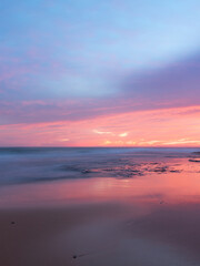 Colorful sunrise sky over the coast.