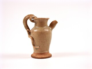 old tea pot pottery mug pitcher stoneware handmade isolated on white background	