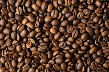 Texture from roasted coffee beans closeup, background.
