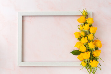 Yellow roses with wooden frame