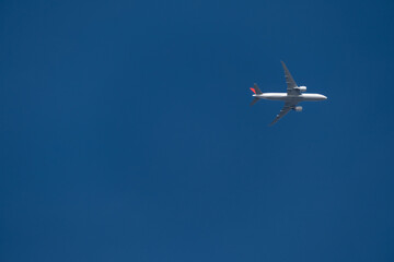 plane in the blue sky