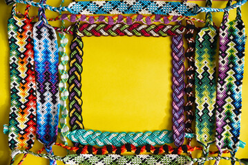 Yellow frame made of woven DIY friendship bracelets