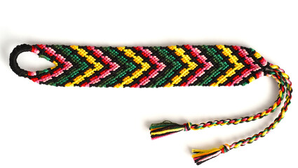 Woven DIY friendship bracelet with bright colorful pattern handmade of thread on white background