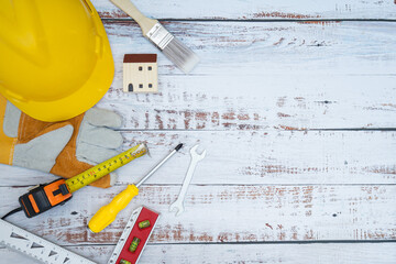 Construction tools on a wooden background. Copy space maintenance concept.