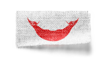 Easter Island flag on a piece of cloth on a white background