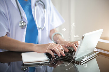 Doctor work on digital tablet healthcare doctor technology tablet using computer in a modern office  in the morning at the desk.