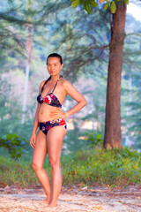 Obraz premium Woman with bikini stand in nature