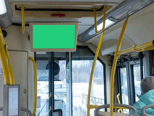 information board in the bus cabin. advertising in public transport. screen on the bus, a place for advertising