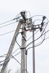 Supports of power lines. Power lines and posts. Detailed close-up.