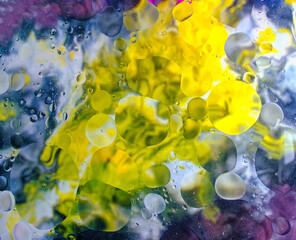 Chaotic multicolor abstract structure under oil bubbles on water surface
