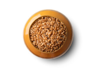 cooked buckwheat porridge in a clay pot in the oven isolated on white background