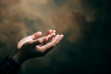 praying hands with faith in religion and belief in God on blessing background. Power of hope or...