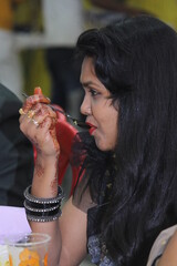woman eating cream in cafe