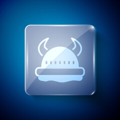 White Viking in horned helmet icon isolated on blue background. Square glass panels. Vector.