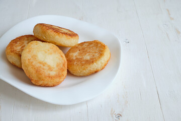 freshly baked cheesecake for breakfast, on a white wooden background