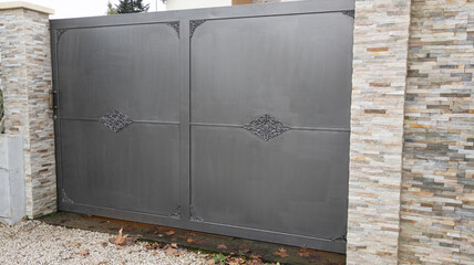 Aluminum vintage steel gray metal gate house portal door of suburb access home